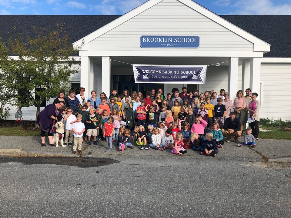 PreK-8 students in front of school on first day